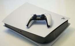 A photo of a Sony Playstation 5 console and controller